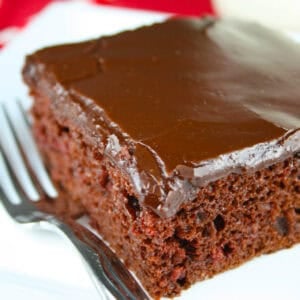 Chocolate Cherry Bar on white plate with fork.