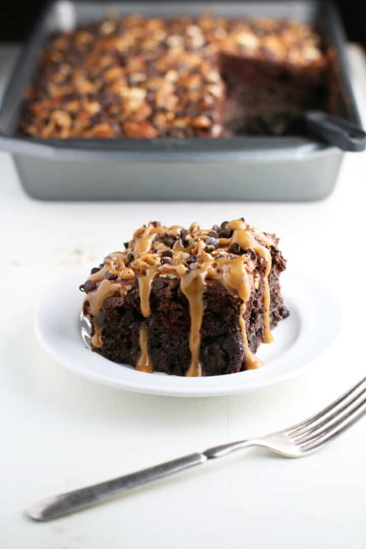 Chocolate Turtle Poke Cake - Mom Loves Baking