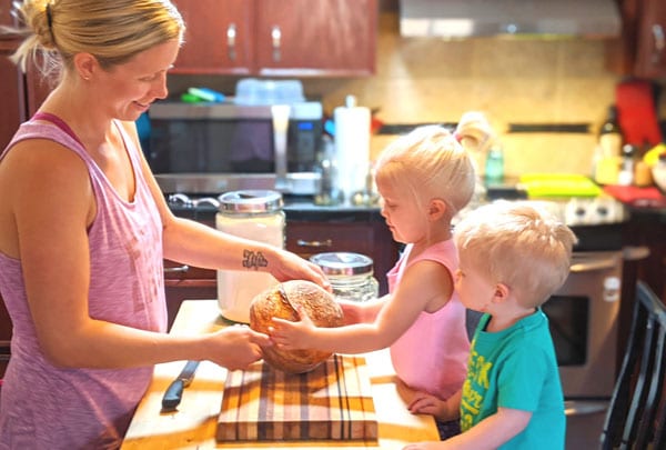 Heather baking sourdough bread with kids