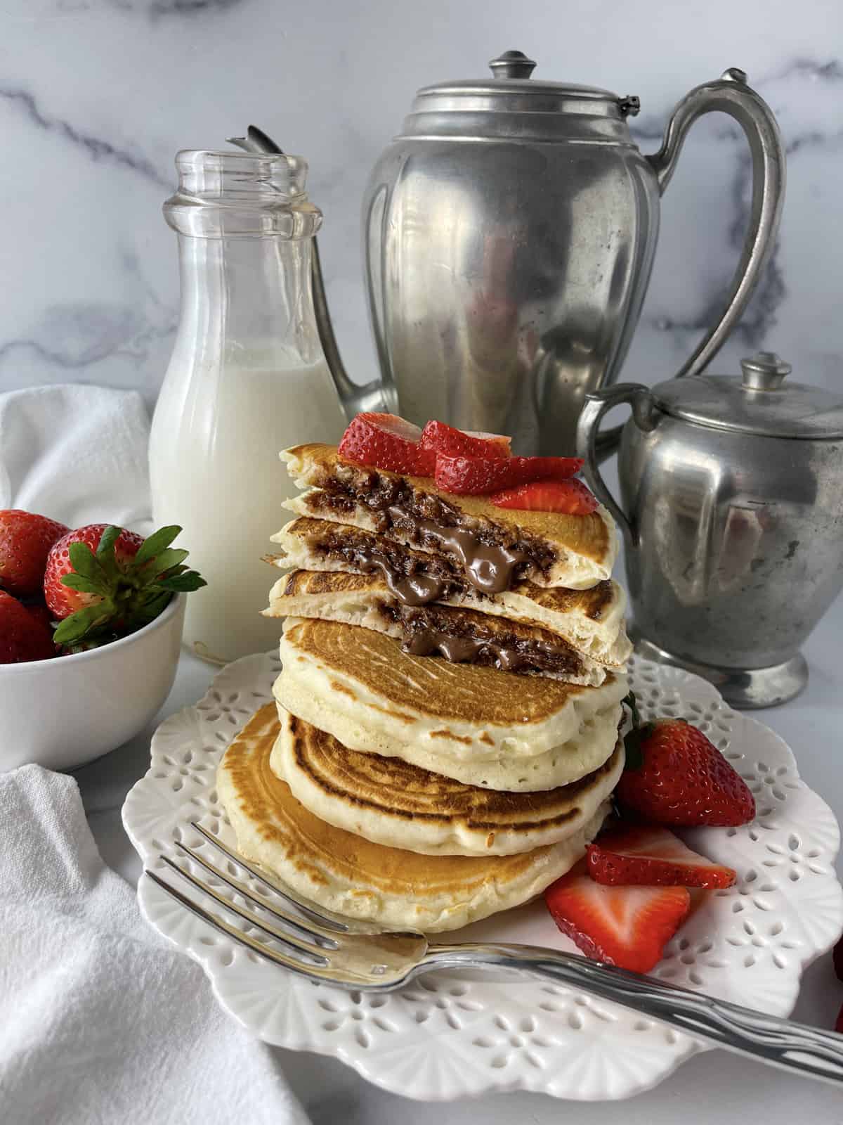 https://www.momlovesbaking.com/wp-content/uploads/2023/04/Nutella-pancakes.jpg