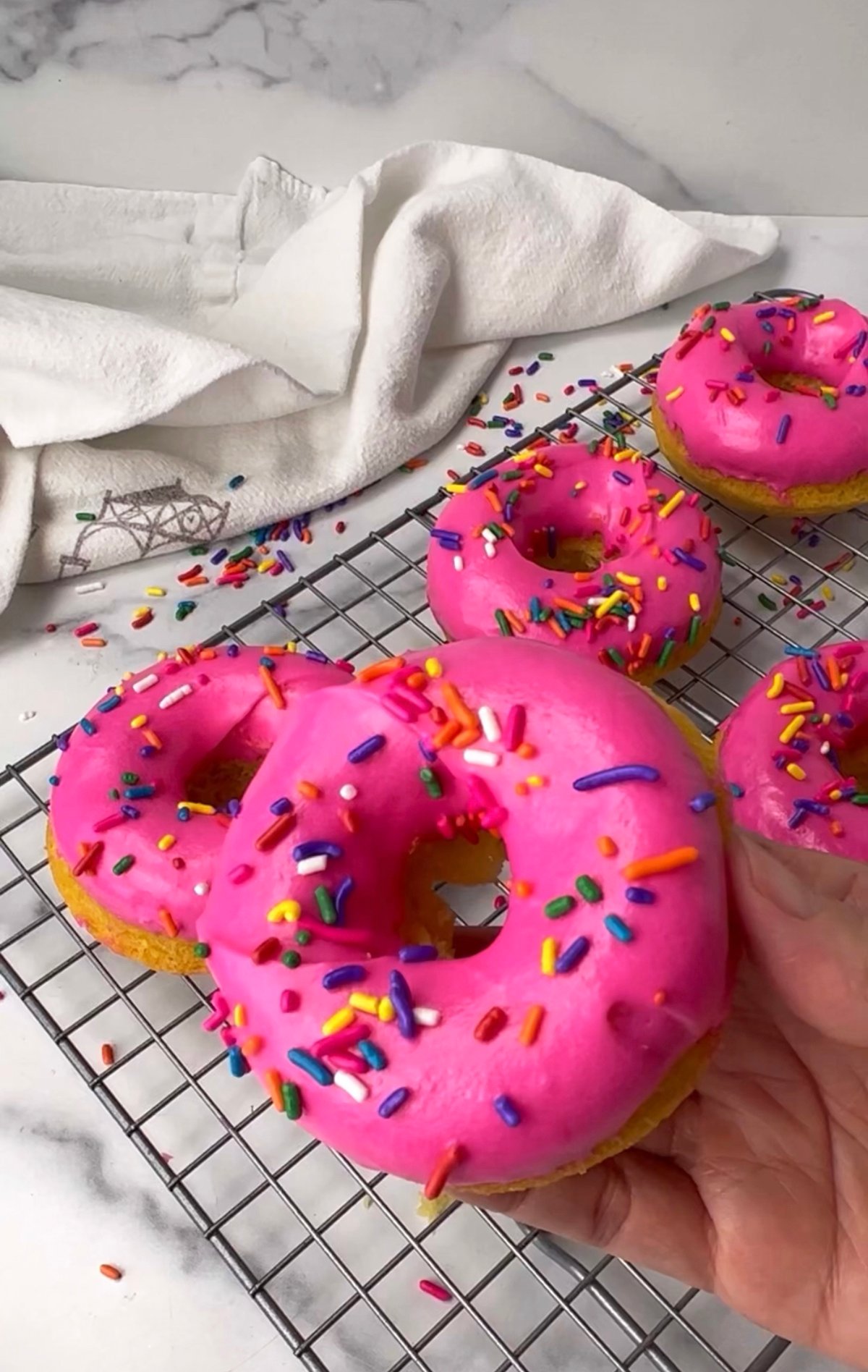 Yummy pink frosted cake donuts.