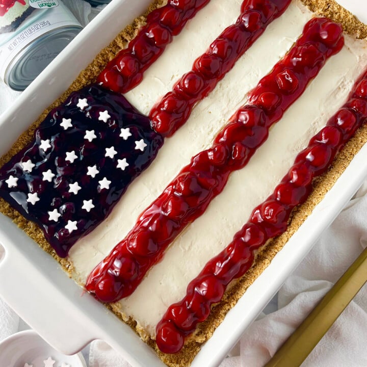 American flag cheesecake no bake dessert in a white oblong casserole dish.