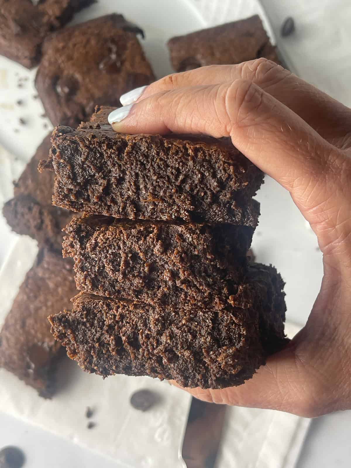 Moist and delicious protein brownies in a stack.