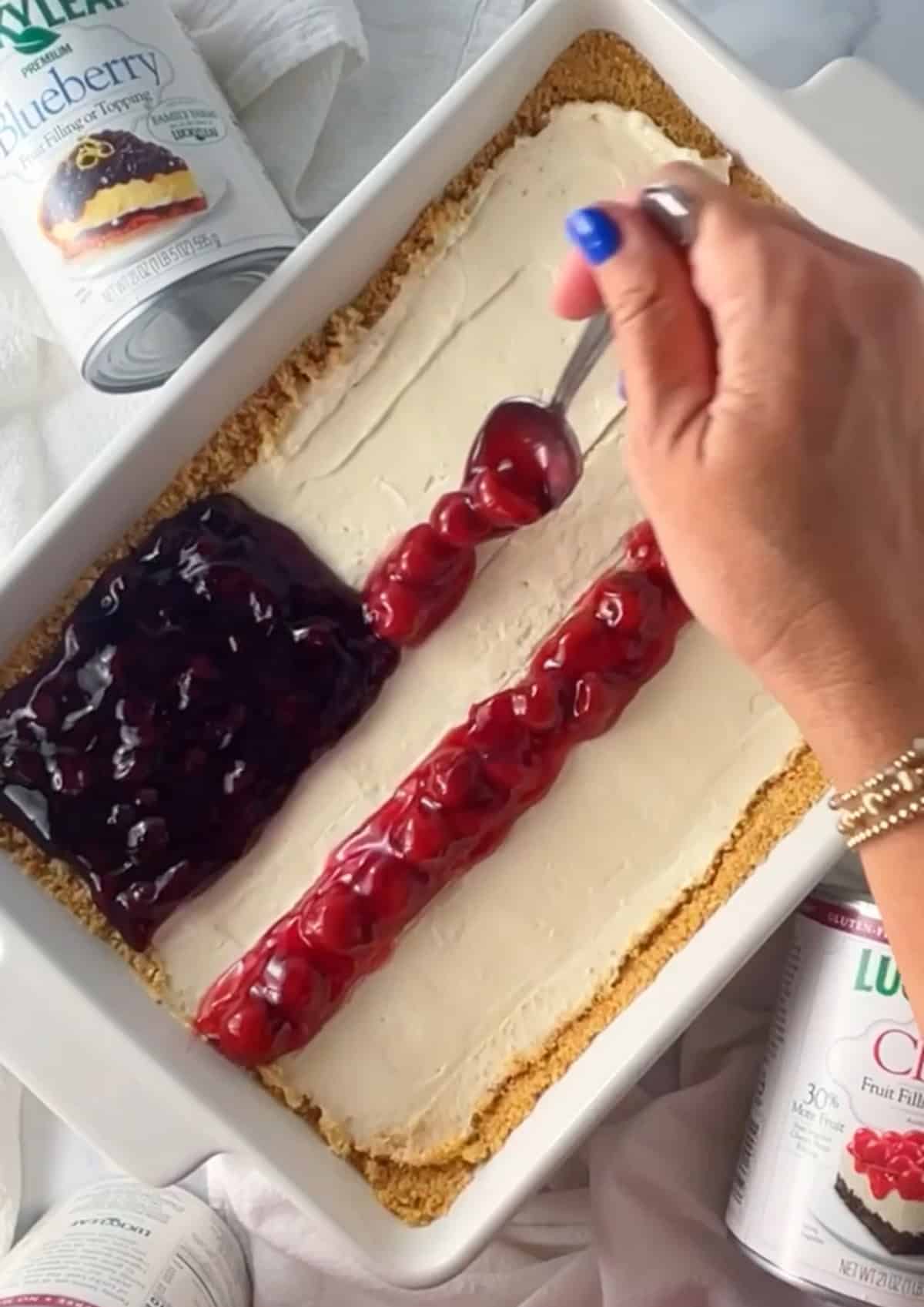 Flag design on cheesecake made of cherry and blueberry fruit filling.