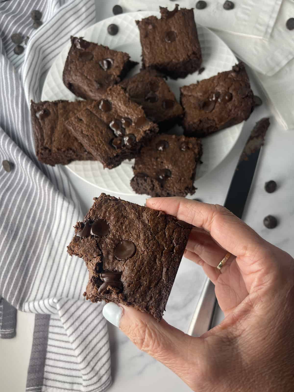 High protein fudgy and chocolatey brownies on a plate.