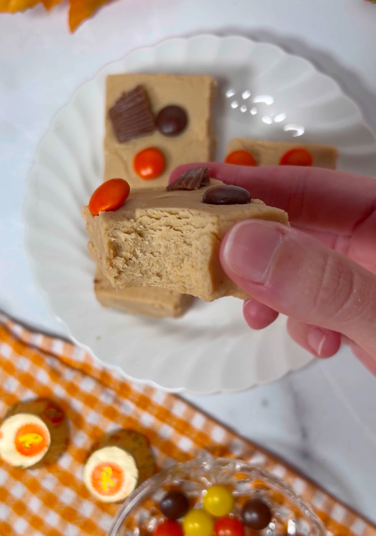 Peanut butter fudge piece with bite taken out.