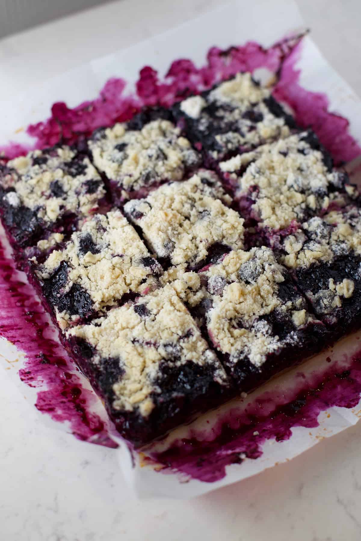 Gluten free blueberry pie bars in pan.