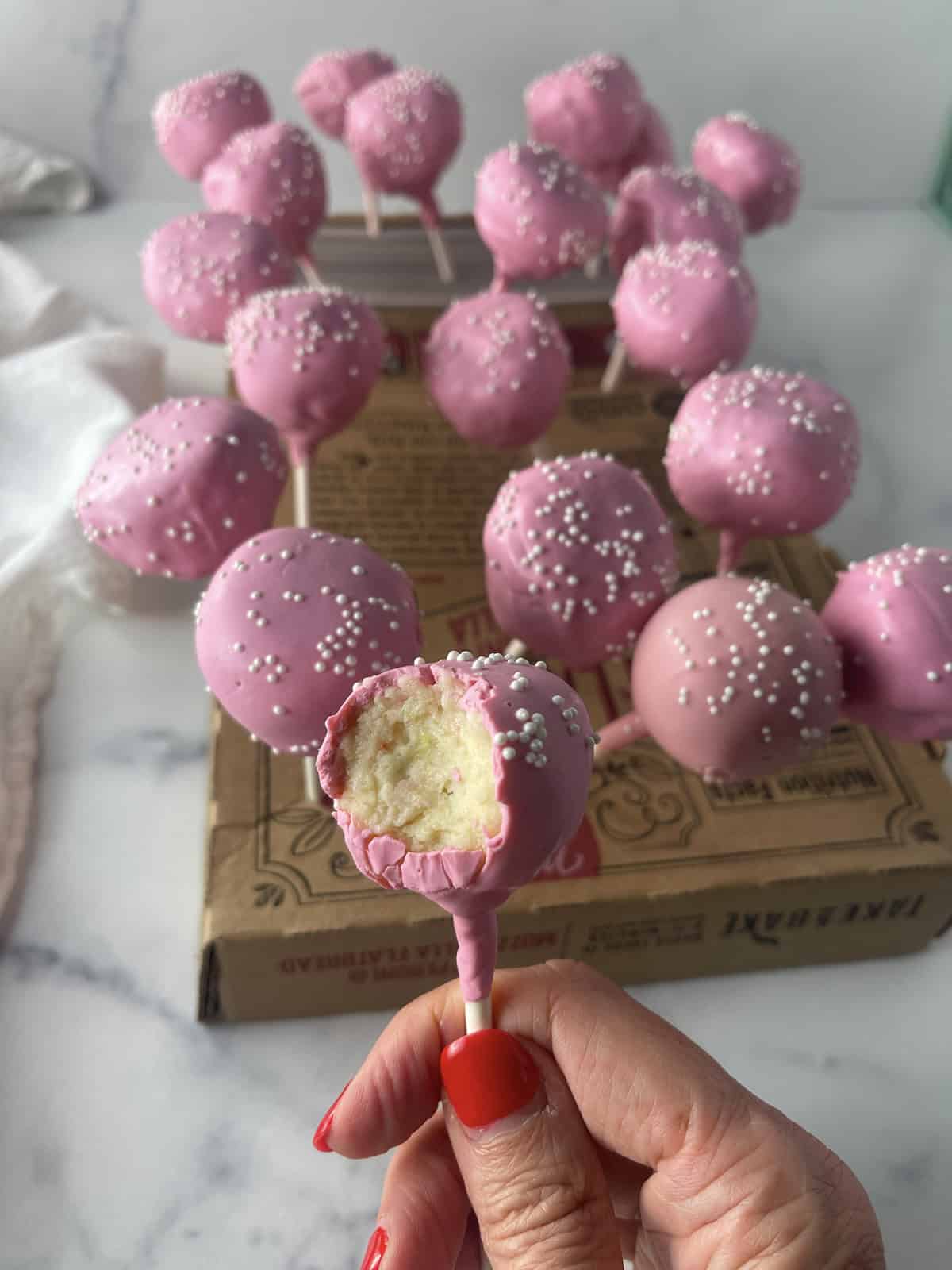 Cake pops in a pizza box.