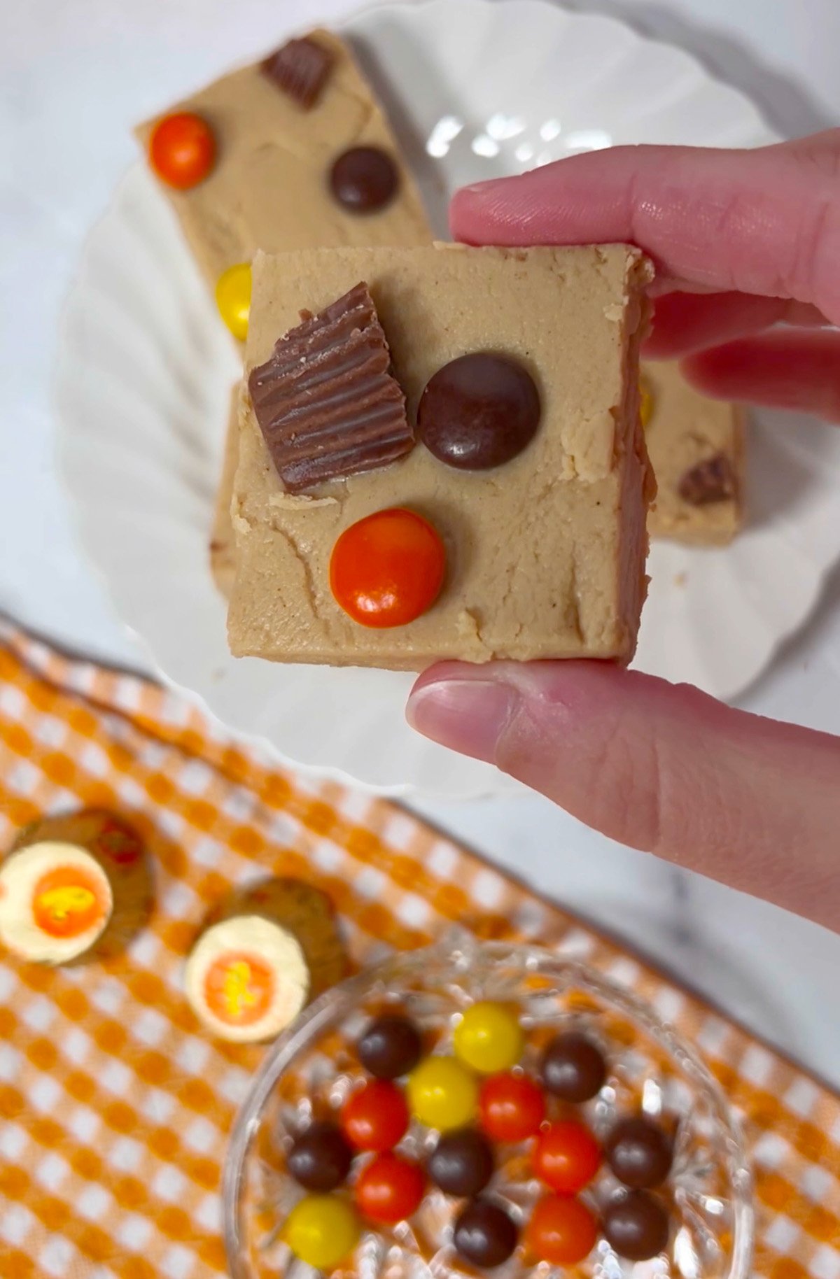 One piece of peanut butter fudge with Reese pieces.