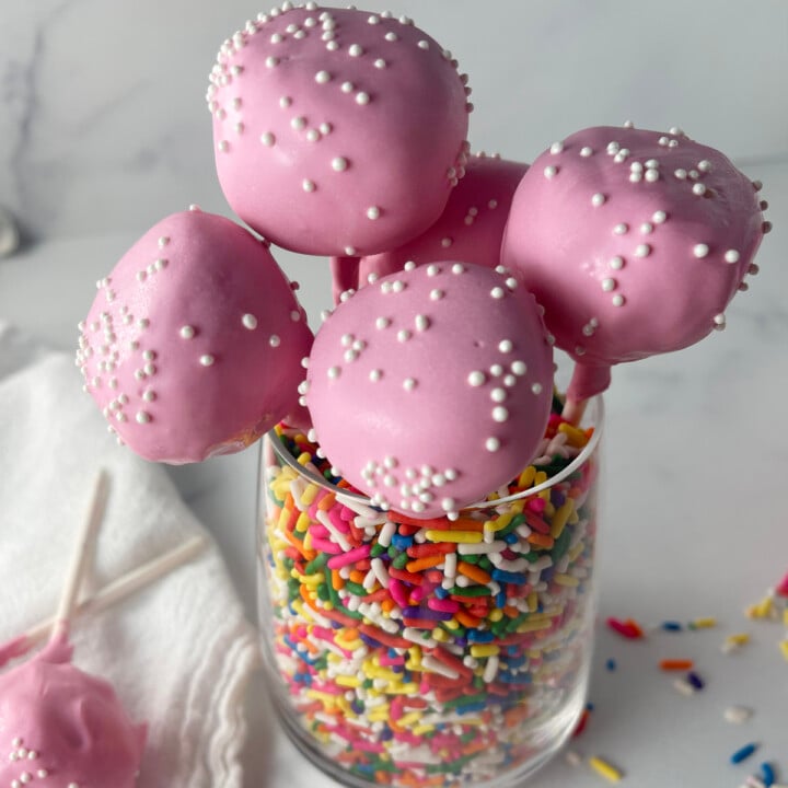 Copycat Starbucks cake pops in a jar of sprinkles.