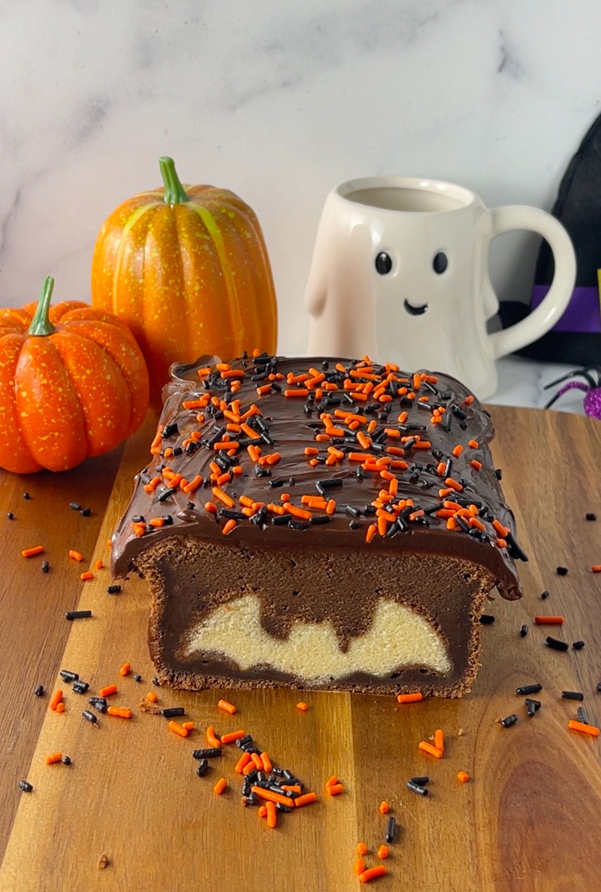 Chocolate pound cake with peek a boo Halloween bat design inside.