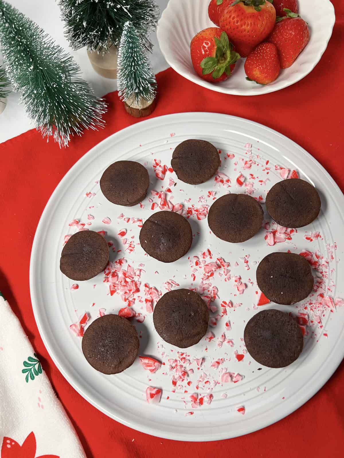 Store bought brownie bites on a white plate.