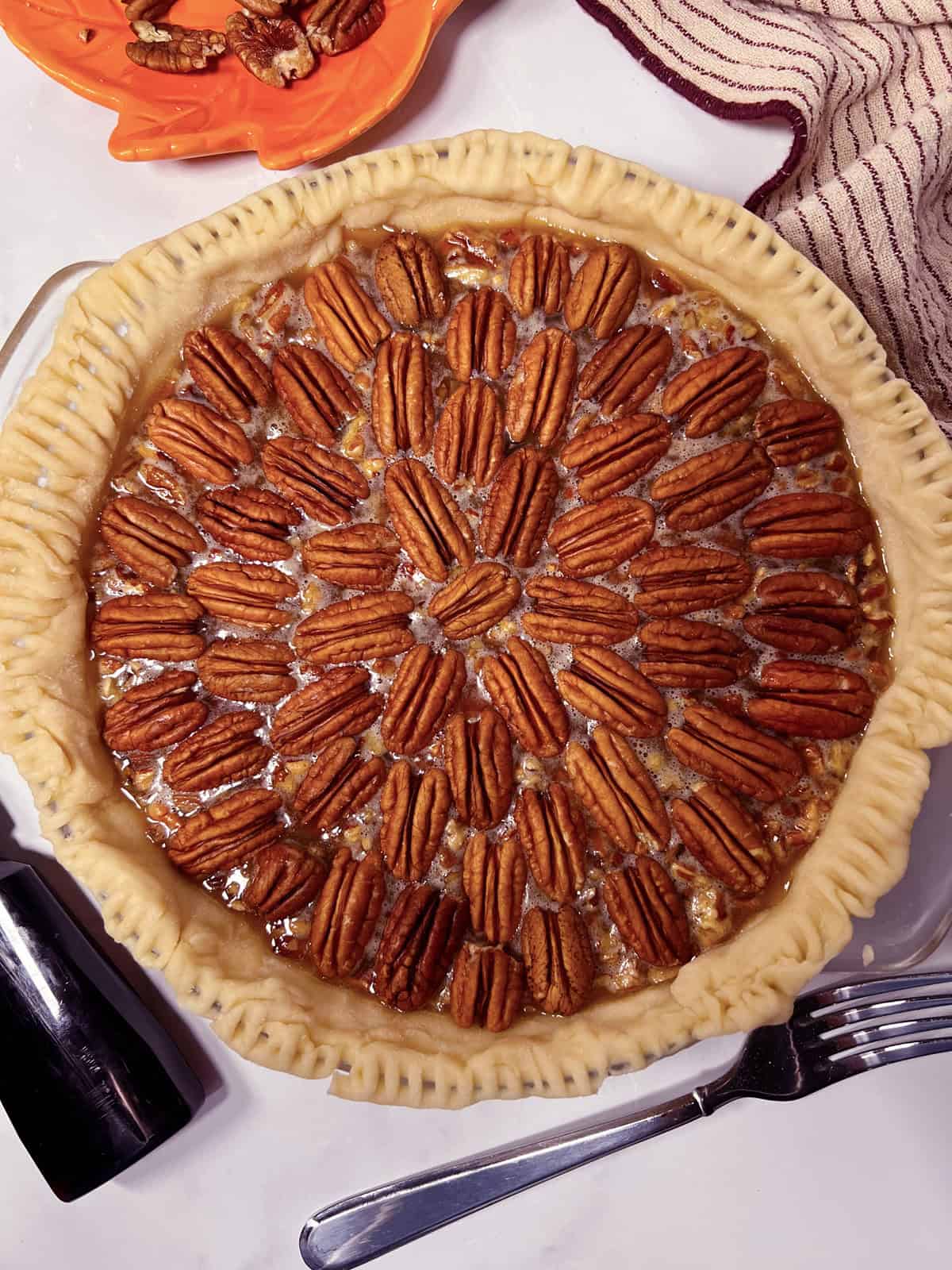 Homemade pecan pie with flaky crust made from scratch.