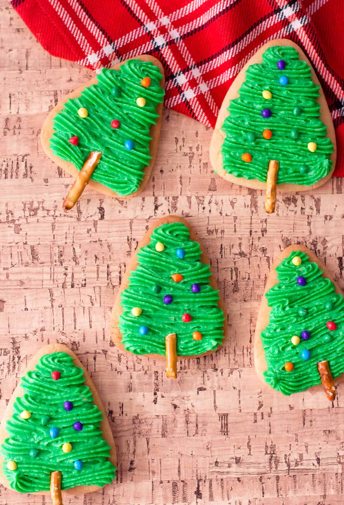 Tree shaped Christmas sugar cookies with buttercream frosting.