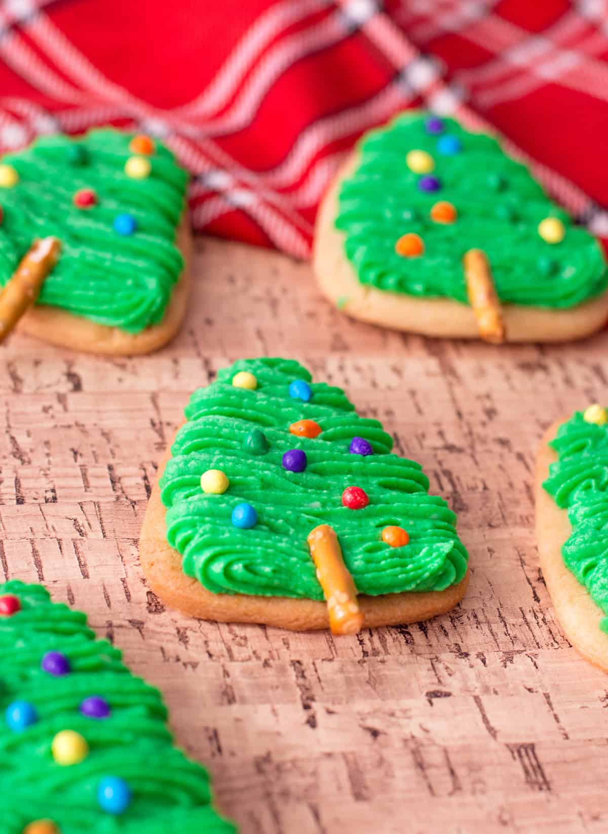 Festive Christmas tree sugar cookies with green buttercream.