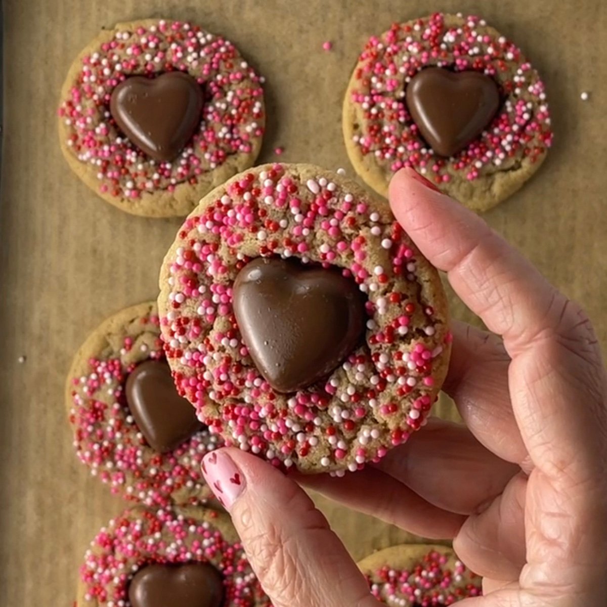 Valentine cookies with chocolate hearts in the middle.