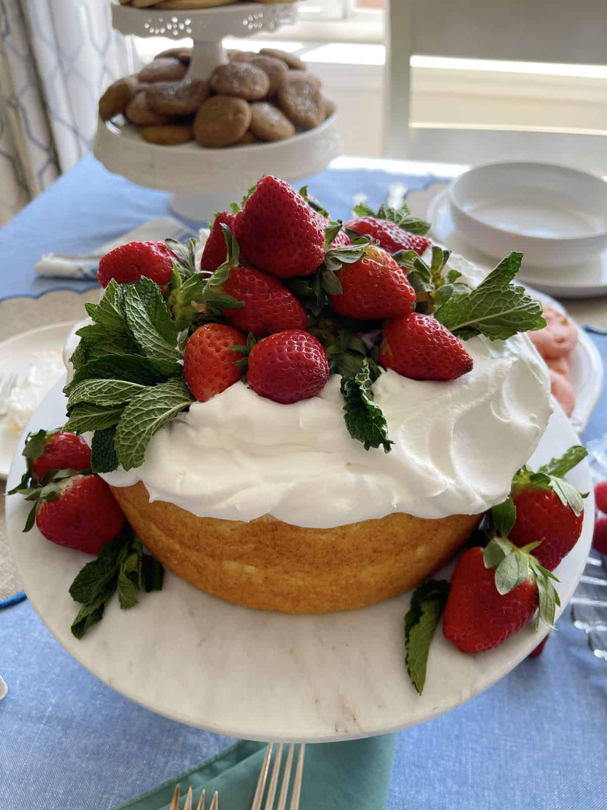 Angel food cake with cool whip and strawberries.