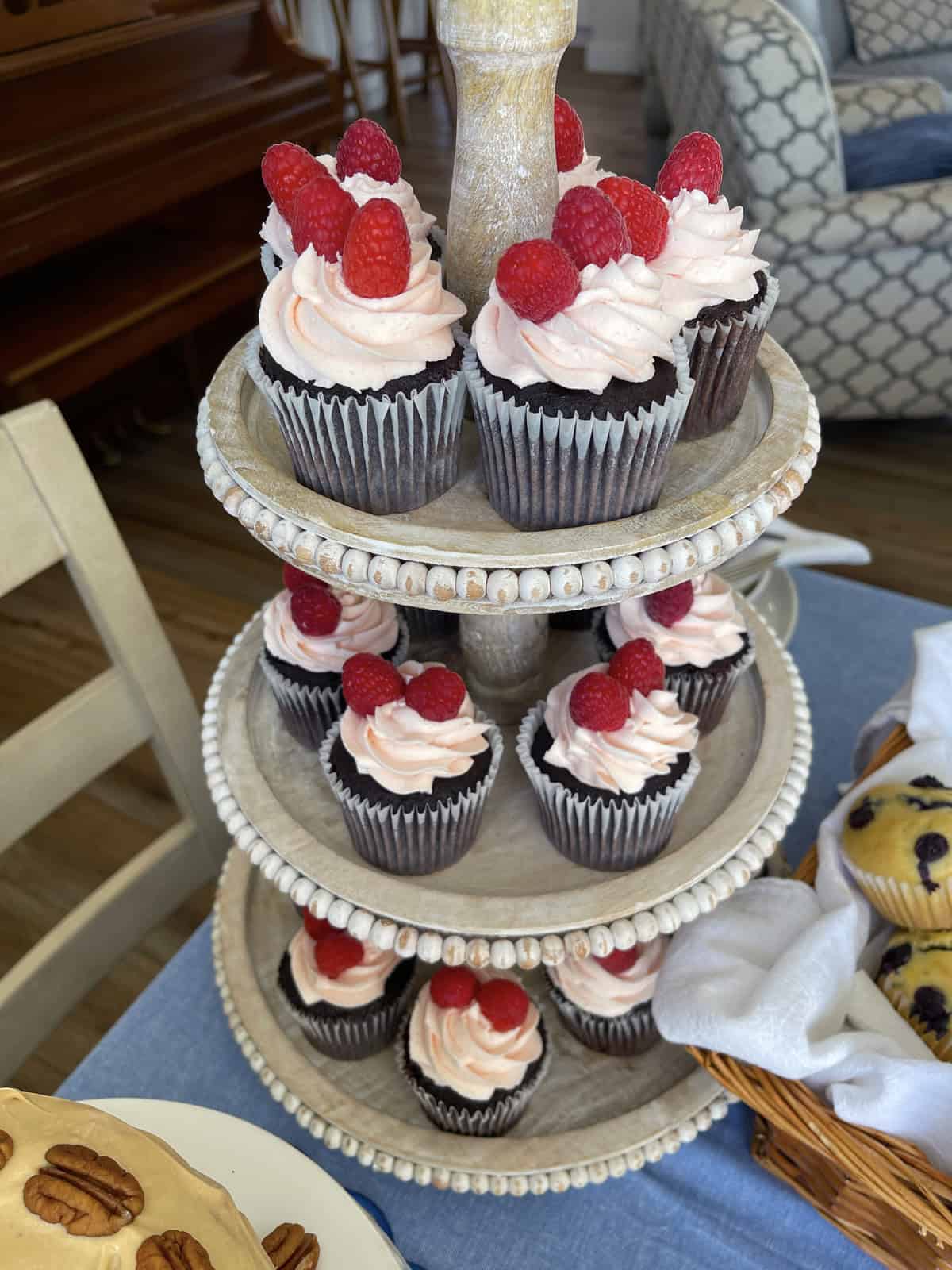 Buttercream cupcakes on a cake stand.